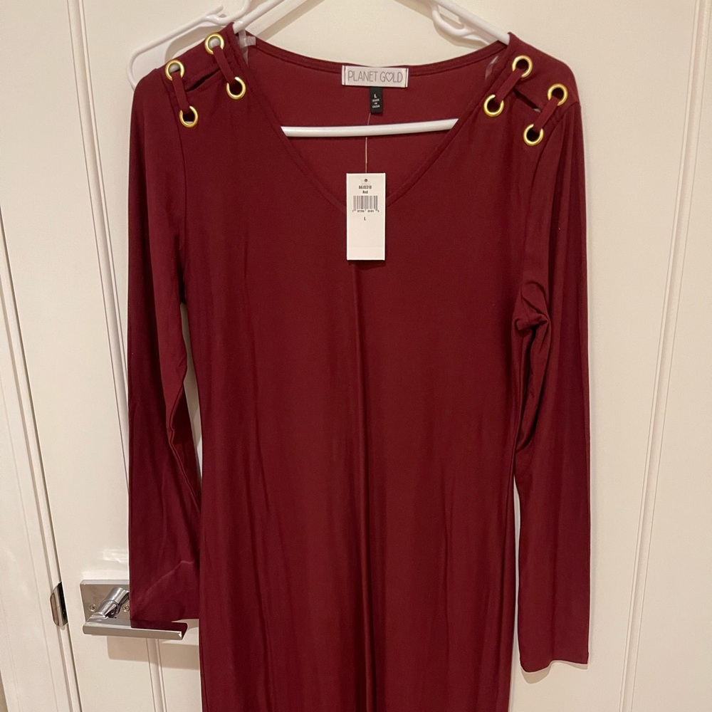 New with price tag. Dress long sleeve red. Fitted style.